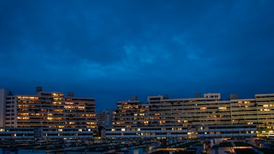 Evening view of residential towers with illuminated windows
