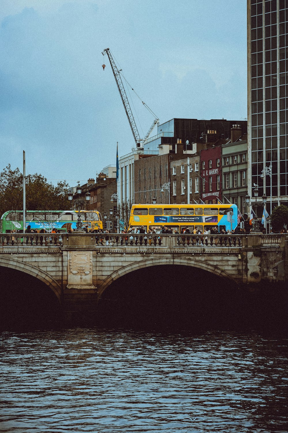 a group of buses that are on a bridge