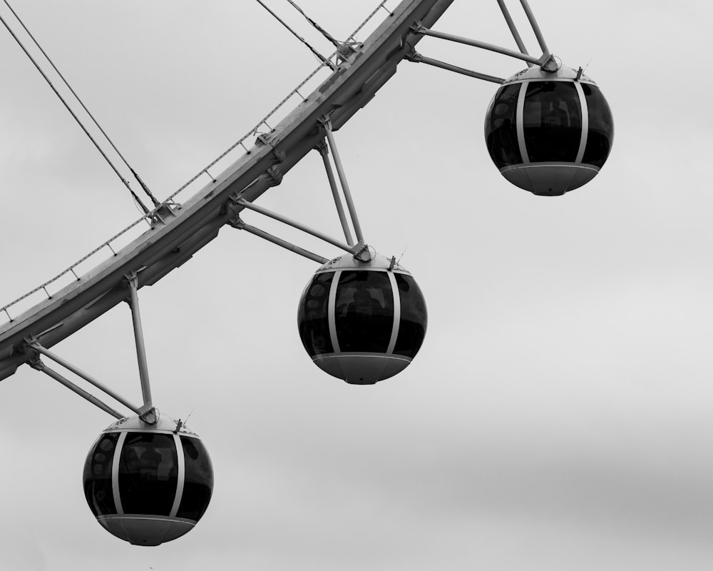 a black and white photo of a ferris wheel