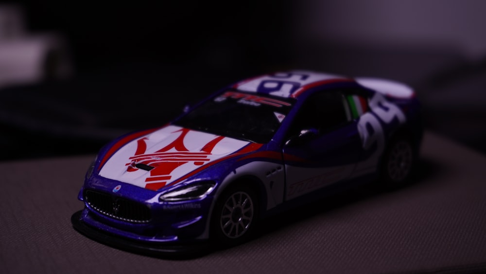 a toy car with a red white and blue design on it