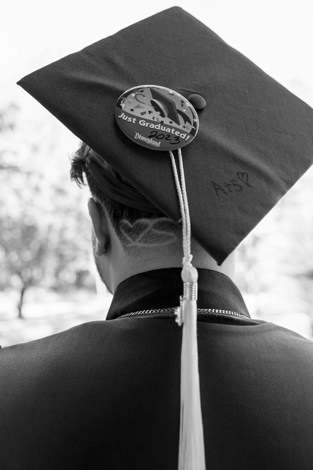 a man in a graduation cap and gown