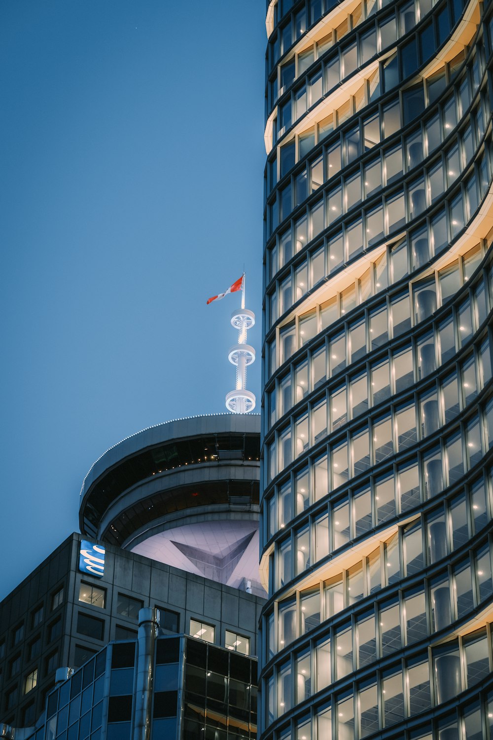 a tall building with a flag on top of it