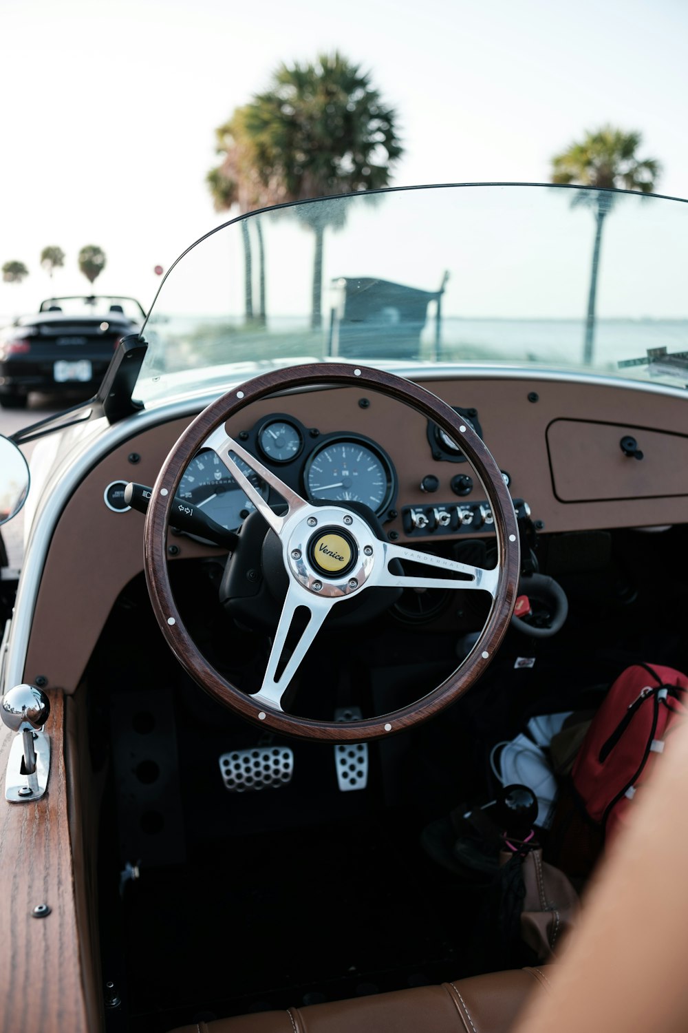 the interior of a car with a steering wheel and dashboard