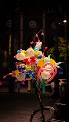 a bicycle with a bunch of balloons attached to it