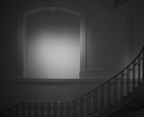 Monochrome image showing freshly painted walls and trim in a modern home interior.