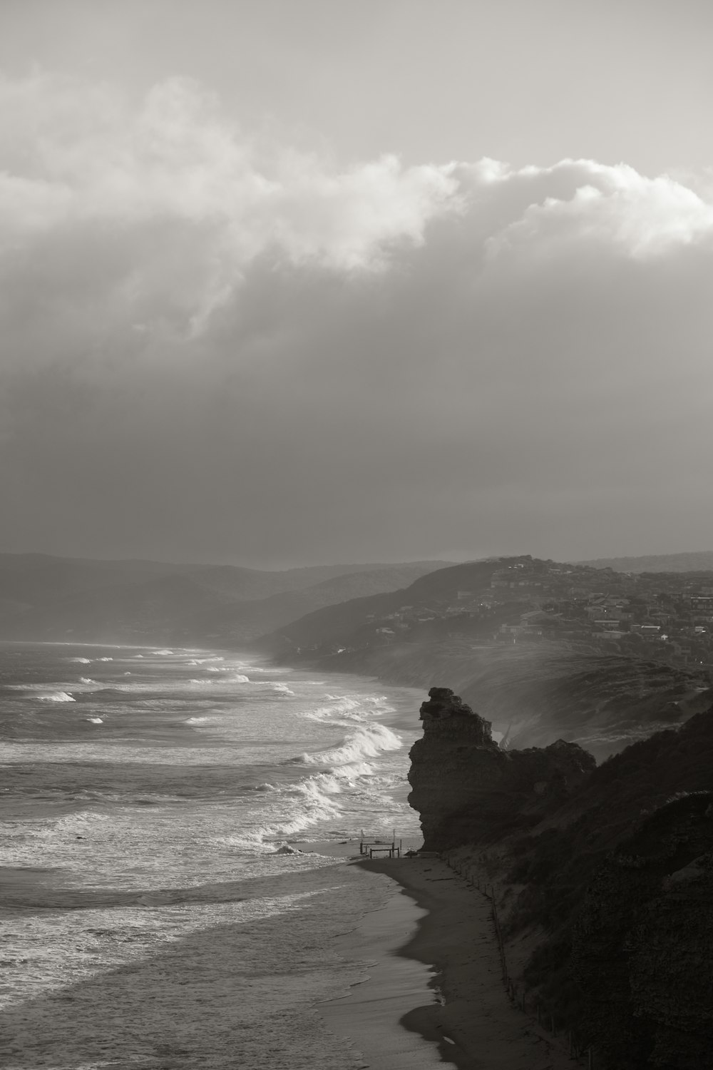 a black and white photo of a beach