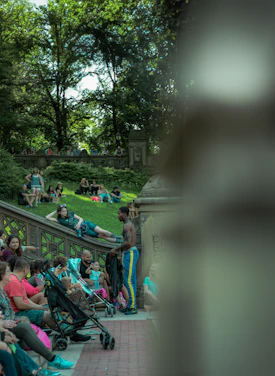 A diverse group of community members collaborating outdoors in a vibrant neighborhood park.