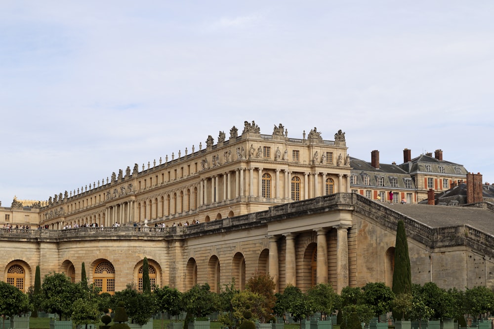 a large building with a lot of trees in front of it