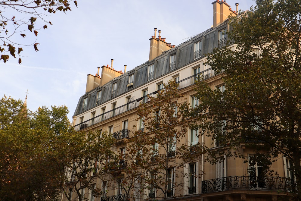 a tall building with many windows and balconies