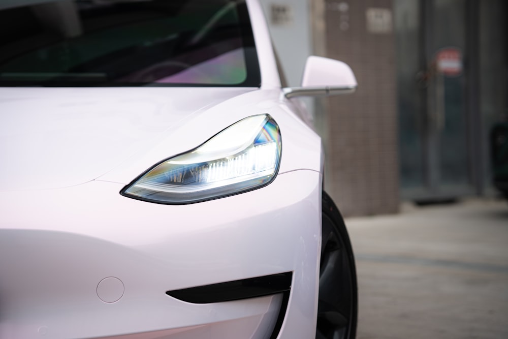 a white car parked on the side of the road