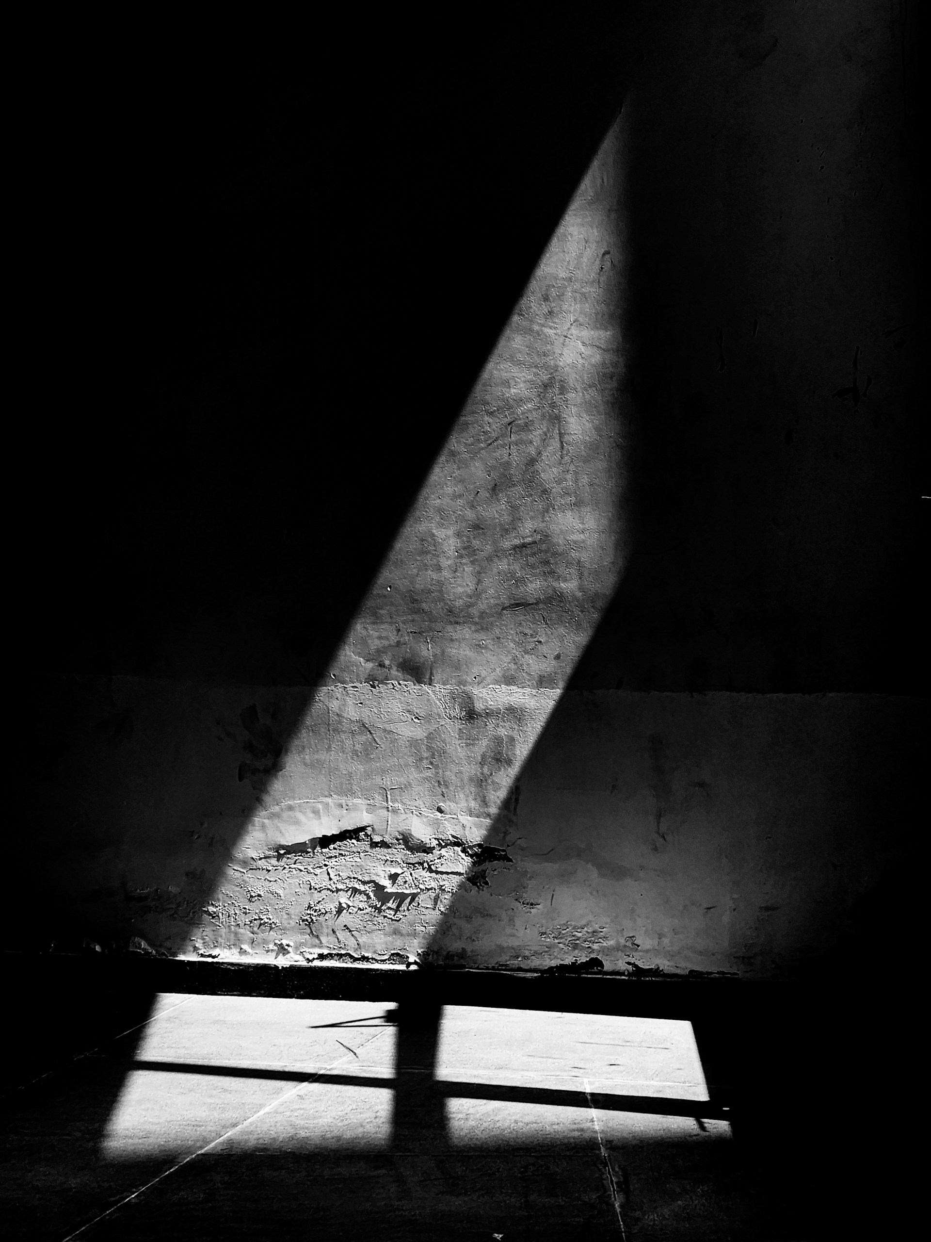 a shadow of a person standing in a room