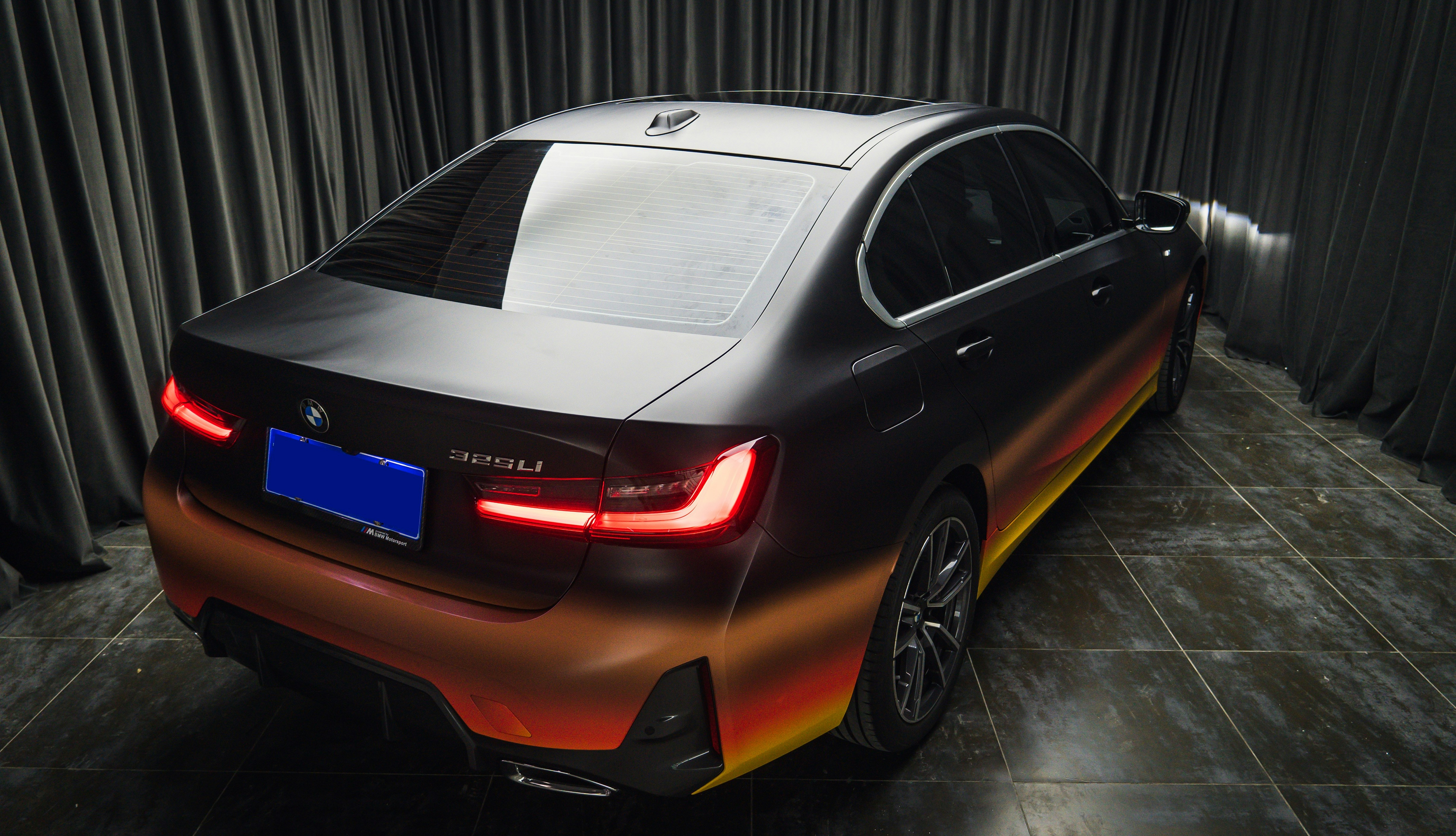 a car that is sitting on a tile floor