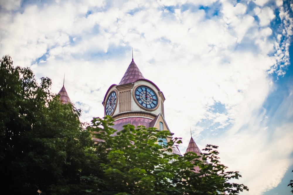 a large clock tower with a sky background