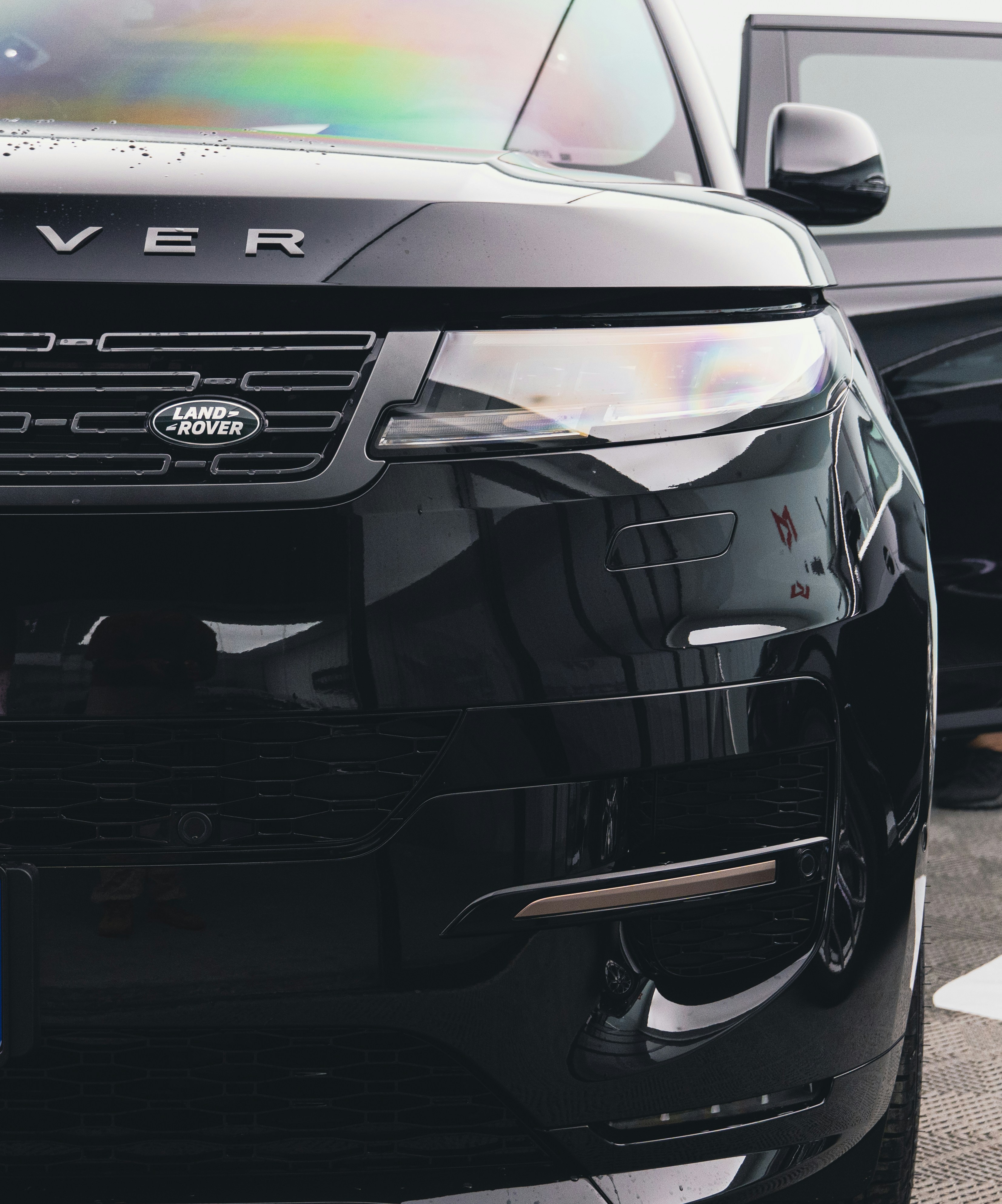 a black range rover parked in a parking lot