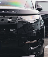 a black range rover parked in a parking lot