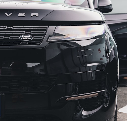 a black range rover parked in a parking lot