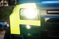 a close up of the front of a yellow truck