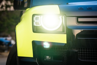 a close up of the front of a yellow truck