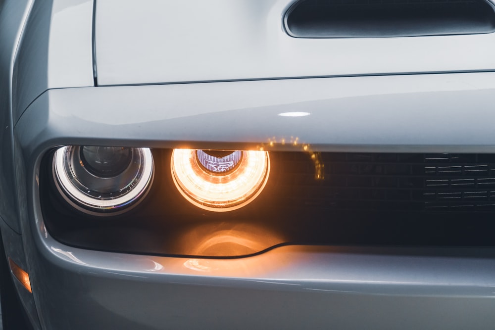 a close up of the headlights of a car