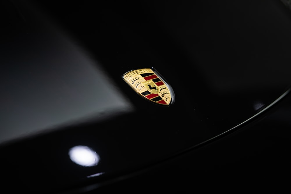 a close up of the emblem on a black car