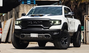 Dodge emblem on a rugged truck parked outdoors.