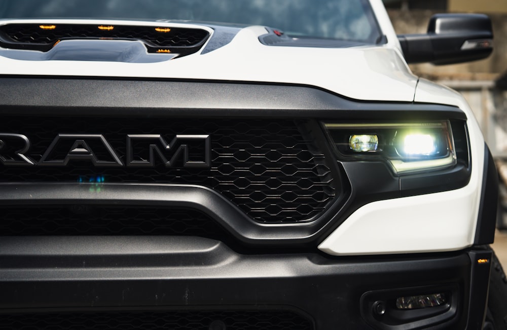 a close up of the front of a white truck