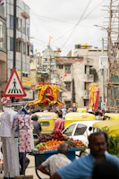 A vibrant street scene in Varanasi with a vendor serving fresh thandai to smiling customers.