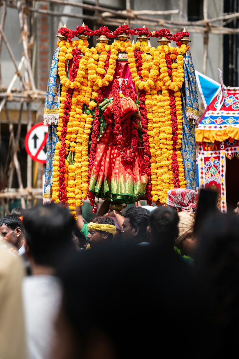 a man in a costume standing in front of a float