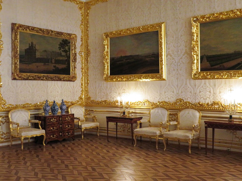 a room with a lot of paintings on the wall