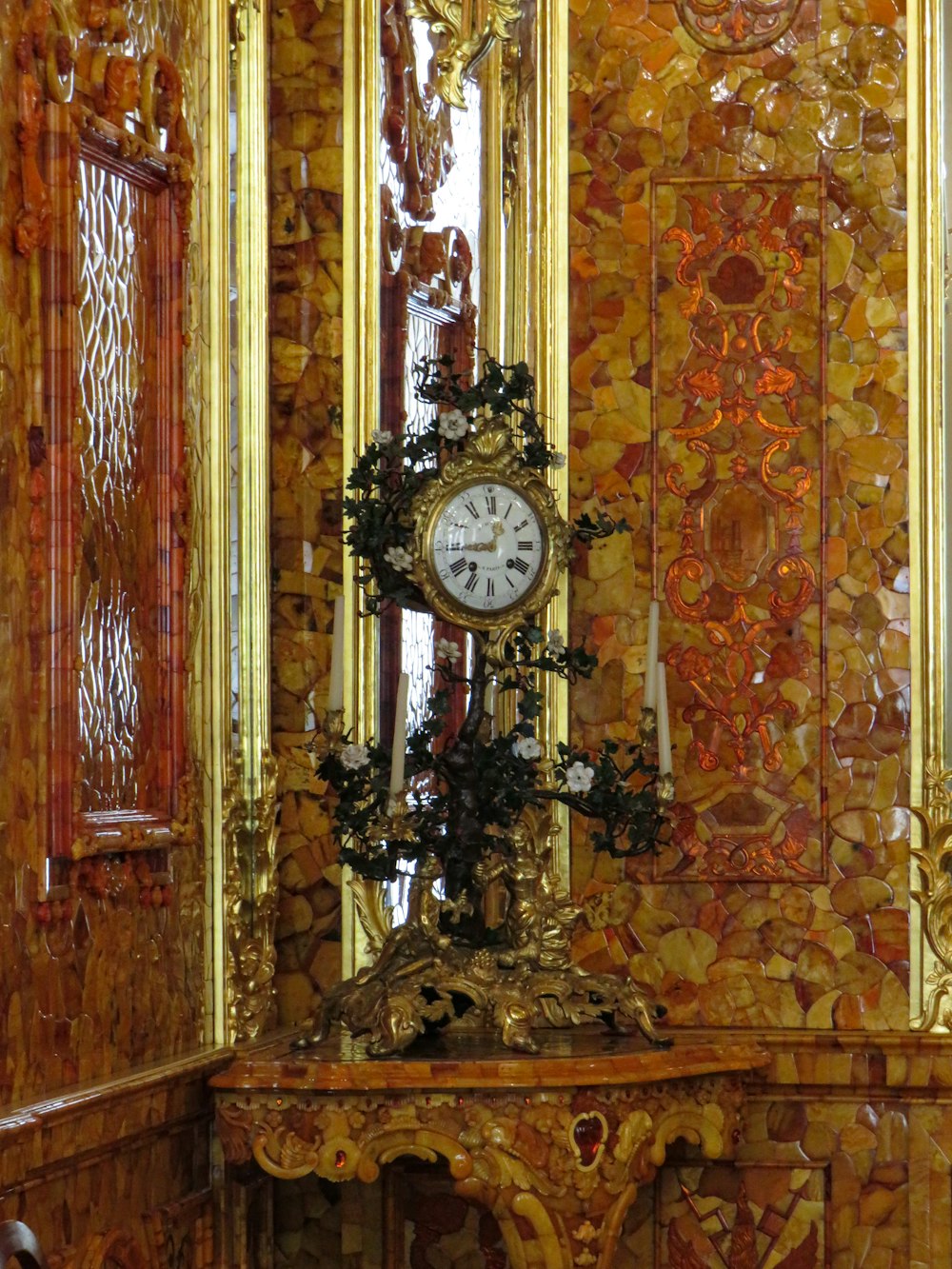 a clock sitting on top of a table in a room