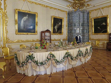 Guests enjoying an elegant dinner inside the mansion’s vintage dining room, with period décor.