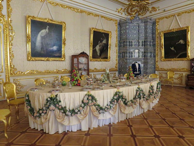 Guests enjoying a refined dinner party in the mansion’s elegant dining room.