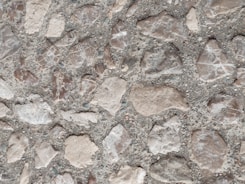 Close-up of handcrafted concrete artifacts with textured surfaces
