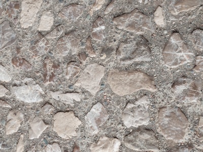 Close-up of a beautifully patterned stamped concrete walkway with earthy tones.