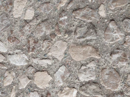 Close-up of stamped concrete showcasing intricate patterns and textures in natural light.
