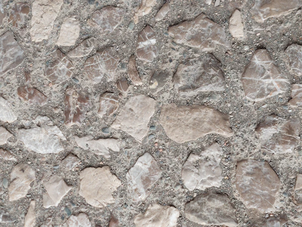 Close-up of decorative stamped concrete walkway featuring natural stone patterns