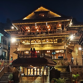 Front view of a charming Lucknow BnB with traditional architecture and warm lighting