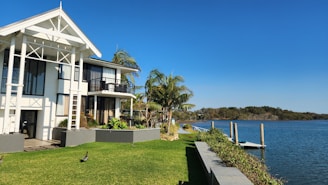 a house on the shore of a body of water