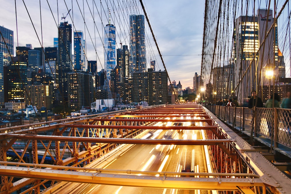 a view of a city at night from a bridge