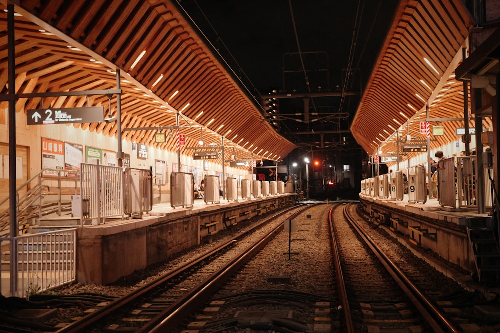 a train station with a train on the tracks