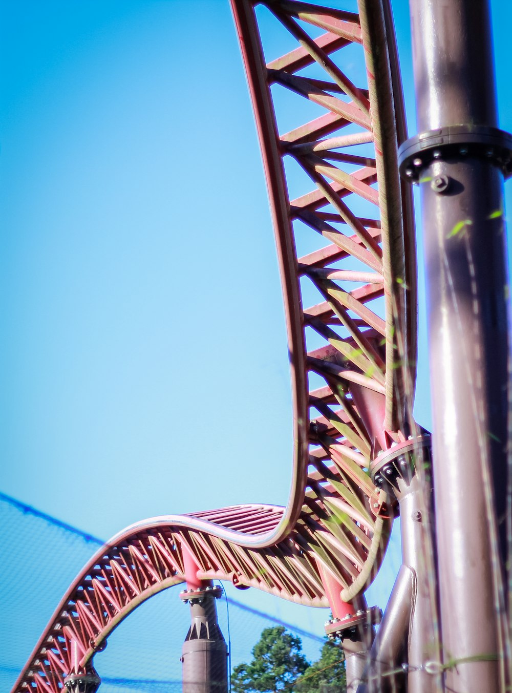 a large metal structure with a red and white design on it