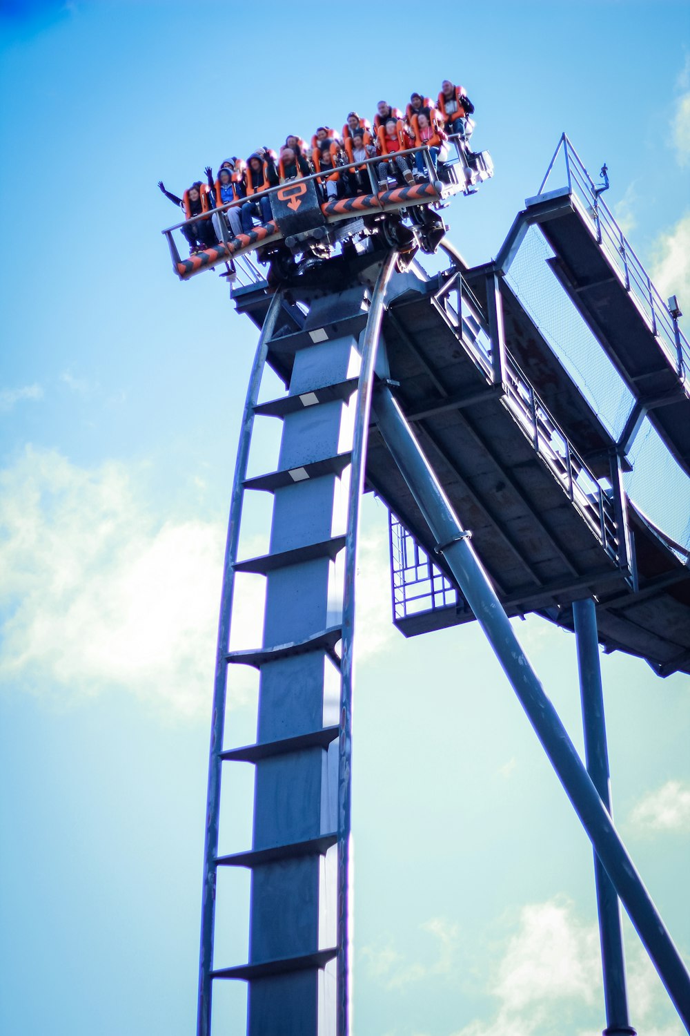 a roller coaster with people riding on it