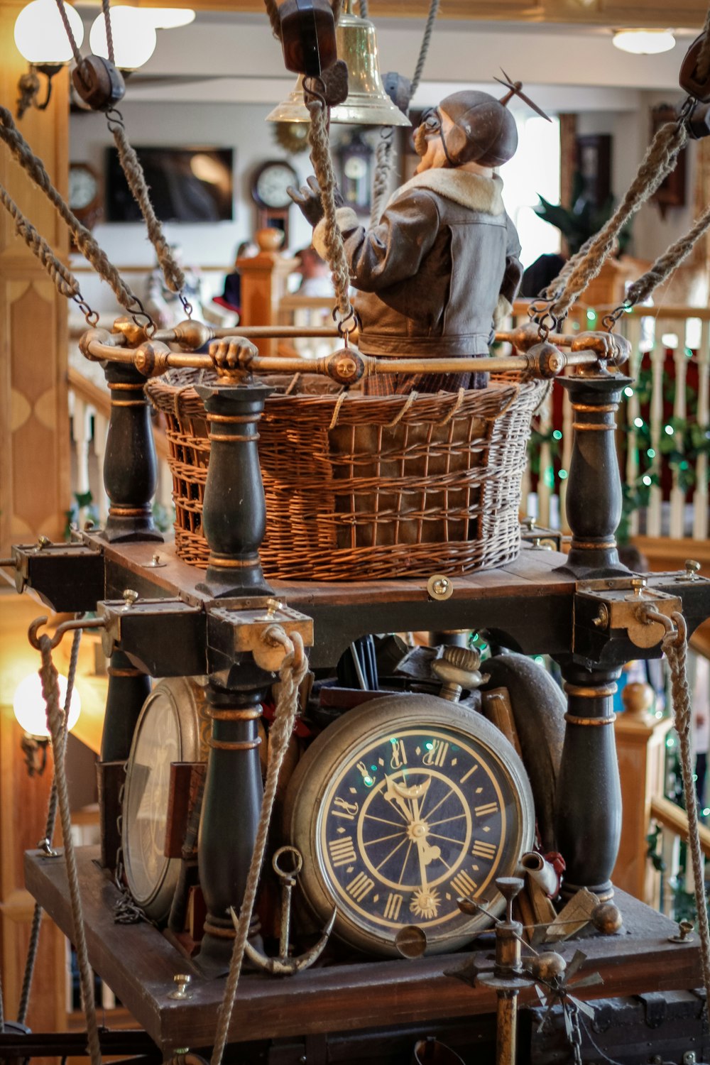 a clock with a man sitting on top of it