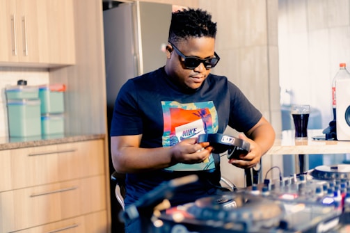 Sala Frias founder adjusting equipment, surrounded by gear from California.