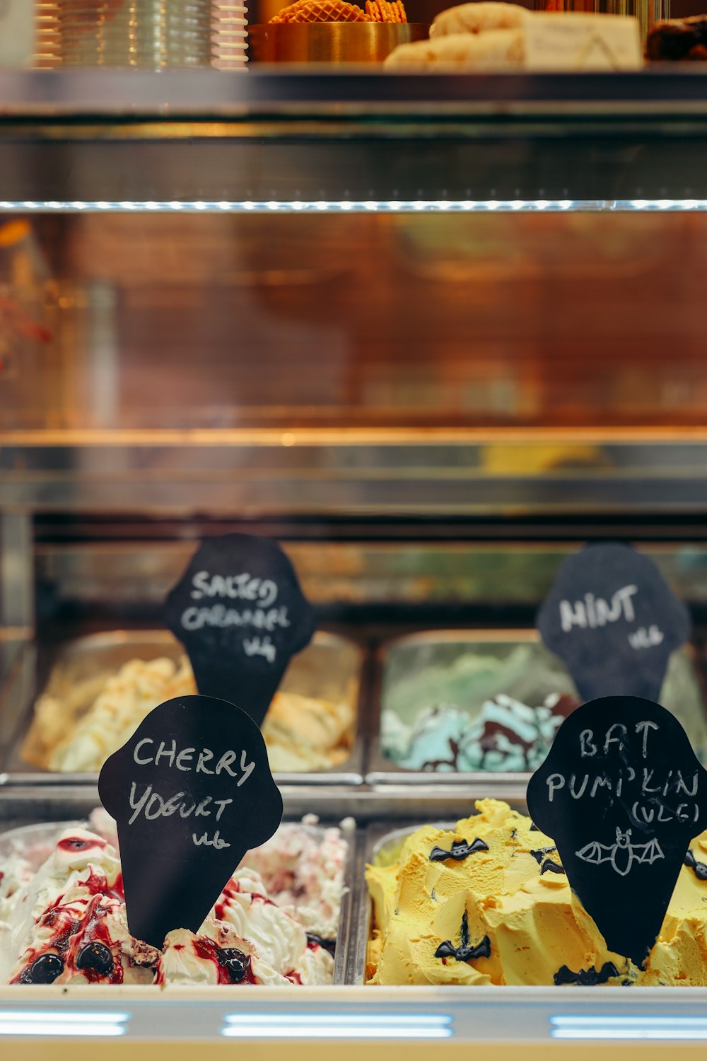 a display case filled with lots of different types of cakes