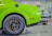 A happy customer standing next to their eco-friendly vehicle with Zentread tires.