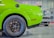 A happy customer standing next to their eco-friendly vehicle with Zentread tires.