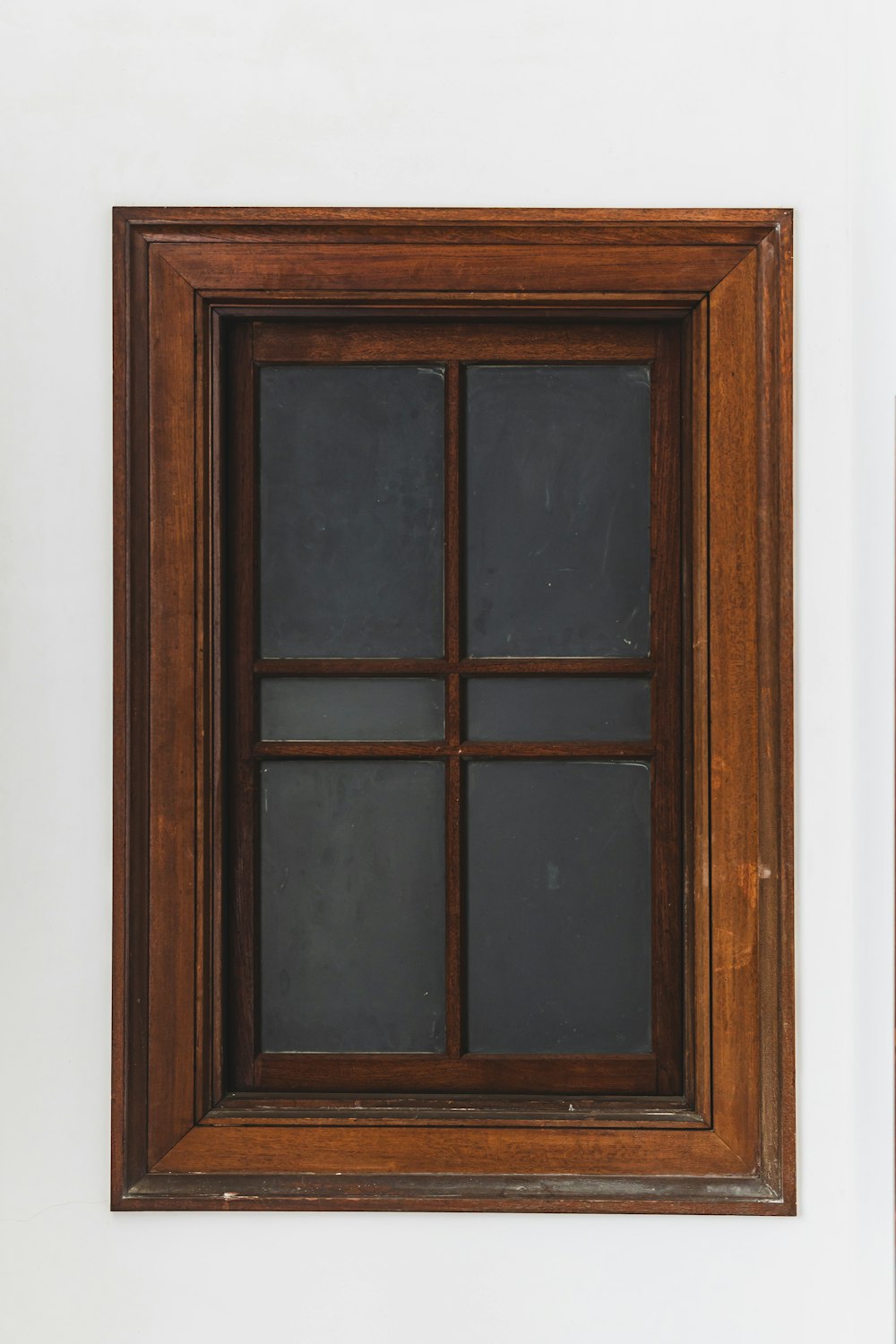 a picture of a window in a white wall