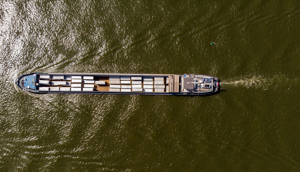 a boat is traveling down the river in the daytime