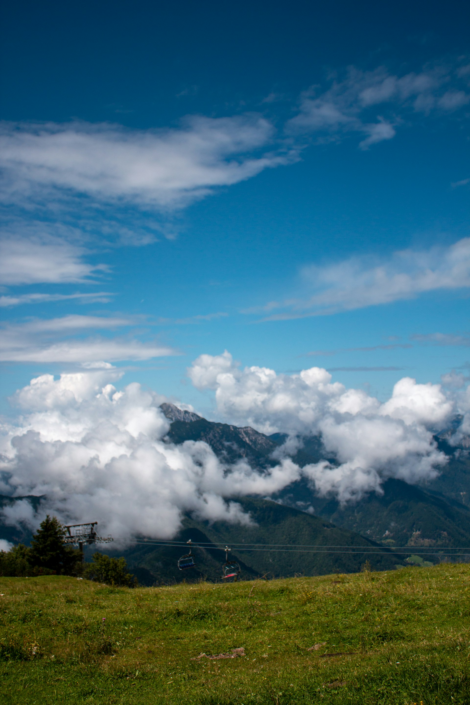 woman wearing yellow long-sleeved dress under white clouds and blue sky during daytime
